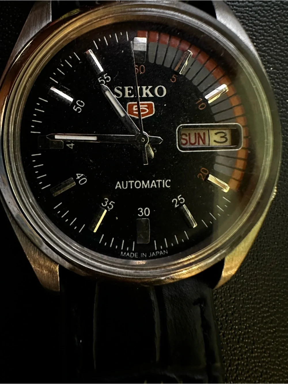 Seiko Black Dial Watch with Orange and Gray Accents